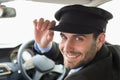 Handsome chauffeur smiling at camera Royalty Free Stock Photo