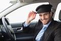 Handsome chauffeur smiling at camera Royalty Free Stock Photo