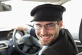 Handsome chauffeur smiling at camera Royalty Free Stock Photo