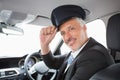 Handsome chauffeur smiling at camera Royalty Free Stock Photo