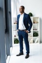 Handsome cheerful african american executive business man at the workspace office. Royalty Free Stock Photo