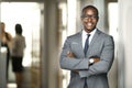 Handsome cheerful african american executive business man at the workspace office