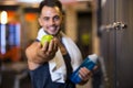 handsome cheerful man showing green apple Royalty Free Stock Photo