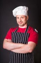 Handsome chef posing against black background Royalty Free Stock Photo