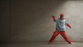 Handsome choreographer practice street dance in gray background. Sprightly.