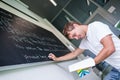 Handsome college student solving a math problem Royalty Free Stock Photo