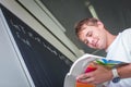 Handsome college student solving a math problem Royalty Free Stock Photo