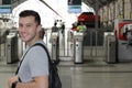 Handsome commuter smiling while waiting for his train Royalty Free Stock Photo