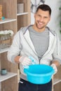handsome concentrated man cleaning flat
