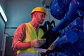 handsome concentrated technician in safety vest