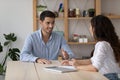 Handsome confident business project leader, boss instructing employee Royalty Free Stock Photo