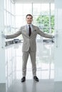 Handsome confident businessman in suit entering the office. Royalty Free Stock Photo