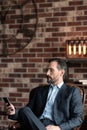 Handsome confident man checking his messages Royalty Free Stock Photo