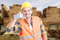 Handsome construction engineer doing a call gesture