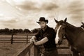 Handsome cowboy, horse rider on saddle, horseback adn boots Royalty Free Stock Photo