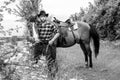 Handsome cowboy, horse rider on saddle, horseback adn boots Royalty Free Stock Photo