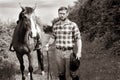 Handsome cowboy, horse rider on saddle, horseback adn boots Royalty Free Stock Photo