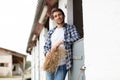 handsome cowboy leaning on wall at ranch Royalty Free Stock Photo