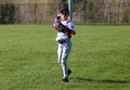 Handsome cute Young boy playing baseball waiting and protecting the base. Royalty Free Stock Photo