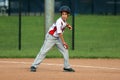 Handsome cute Young boy playing baseball waiting and protecting the base. Royalty Free Stock Photo