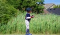 Handsome cute Young boy playing baseball waiting and protecting the base. Royalty Free Stock Photo