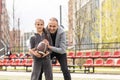 Handsome dad with his little cute daughter are having fun and playing American football on green grassy lawn Royalty Free Stock Photo