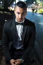 Handsome dark skin man wearing a tuxedo and a bow tie Royalty Free Stock Photo