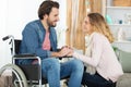 handsome disabled man holding girlfriend hands Royalty Free Stock Photo