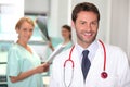 Handsome doctor and colleagues Royalty Free Stock Photo