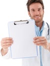 Handsome doctor holding blank sheet smiling