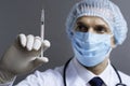 Handsome doctor holding hypodermic needle Royalty Free Stock Photo