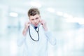 Handsome doctor listening with a stethoscope Royalty Free Stock Photo