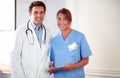 Handsome doctor and pretty nurse looking at you Royalty Free Stock Photo