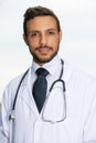 Handsome doctor in white coat with stethoscope Royalty Free Stock Photo