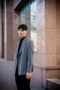 Handsome eastern man in suit, fashion, street style. Royalty Free Stock Photo