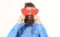 Handsome elegant guy in denim shirt holding heart and smiling Royalty Free Stock Photo