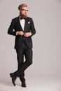 Handsome elegant man closing his jacket. Royalty Free Stock Photo