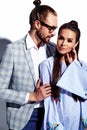 Handsome elegant man in glasses in suit with beautiful woman in colorful dress Royalty Free Stock Photo