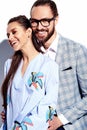 Handsome elegant man in glasses in suit with beautiful woman in colorful dress Royalty Free Stock Photo