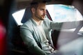 Handsome elegant serious man drives a car Royalty Free Stock Photo