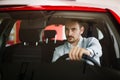 Handsome elegant serious man drives a modern car Royalty Free Stock Photo