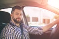 Handsome elegant serious man drives a car Royalty Free Stock Photo