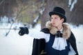 Handsome elegantyoung man with rapier, outdoor