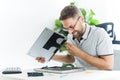 Handsome engineer repairing laptop computer. Royalty Free Stock Photo