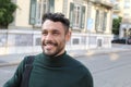 Handsome entrepreneur walking around with elegant turtle neck shirt Royalty Free Stock Photo