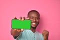 handsome excited young black man feeling excited while showing his phone screen Royalty Free Stock Photo