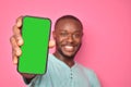 handsome excited young black man feeling excited while showing his phone screen Royalty Free Stock Photo