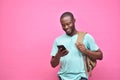 handsome excited young black man feeling excited while viewing content on his smartphone