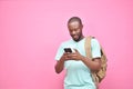 handsome excited young black man feeling excited while viewing content on his smartphone