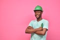 handsome excited young black man wearing a hard hat and holding a screwdriver feeling excited giving thumbs up gesture Royalty Free Stock Photo